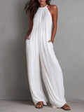 Pleated Resort-Style Jumpsuit with Open Back and Wide-Leg Trousers